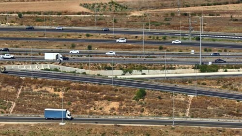 Highway traffic on multiple highways roads with traffic on all roads, Aerial footage