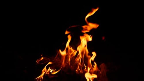 Fire burning yellow and orange flame effect in darkness