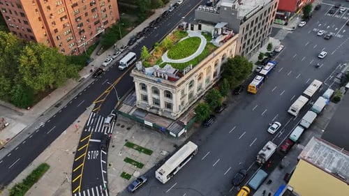 An aerial view of a city with a green roof