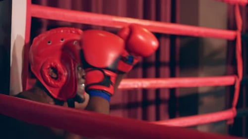 African sportsman warms up body before exercise at fitness stadium.