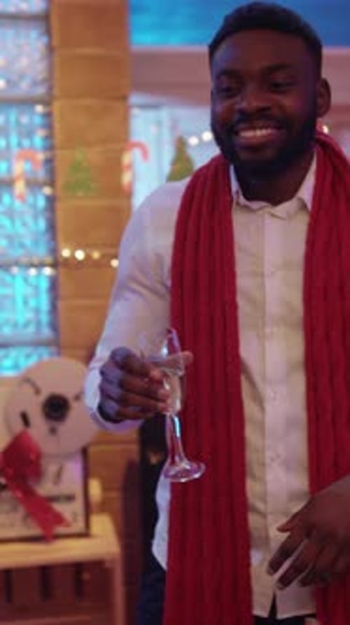 Happy Group Toasting Champagne at Christmas Party