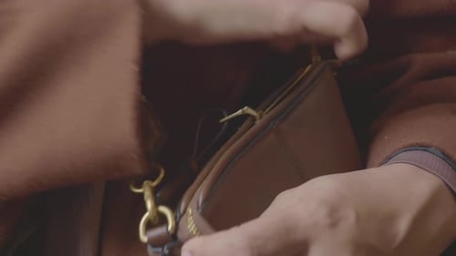 Women Zipping Her Purse Close Up