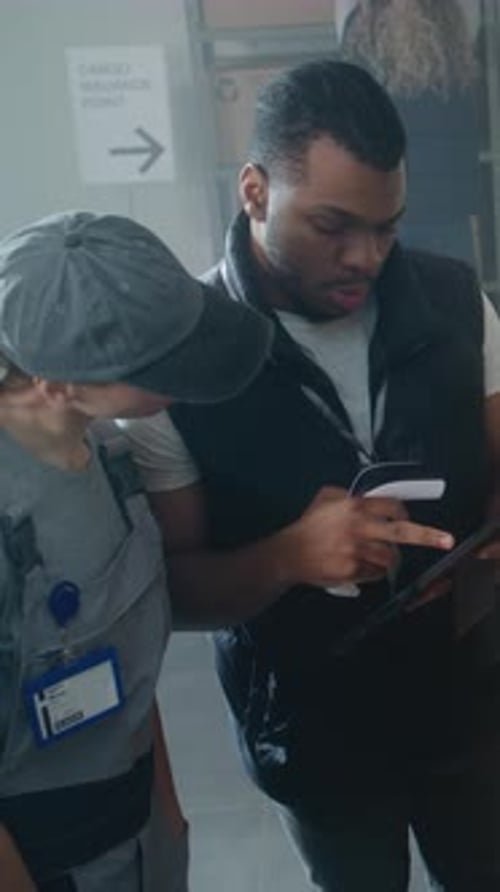Diverse Inventory Specialists Scan Parcels Check Delivery Information on Tablet Computer