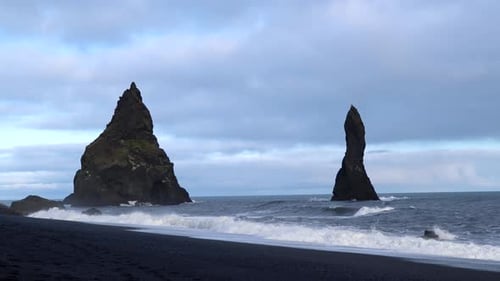 Beautiful Rocks in the Water at Reynisfjara Black Sand Beach in Iceland, 4K