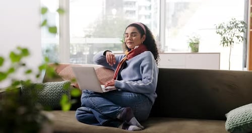 Face, woman and relax with laptop at house for remote work, editing article and story research
