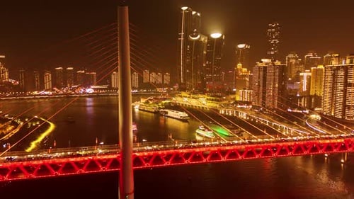 Aerial: Twin River Bridges at night in Chongqing with cityscape and skyscrapers, Yuzhong District