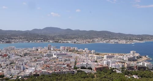 Aerial drone footage of the town of Sant Antoni de Portmany on the west coast of Ibiza, one of Spain