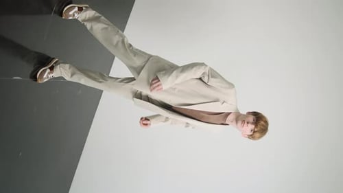 Young Adult Poses in Fashionable Suit