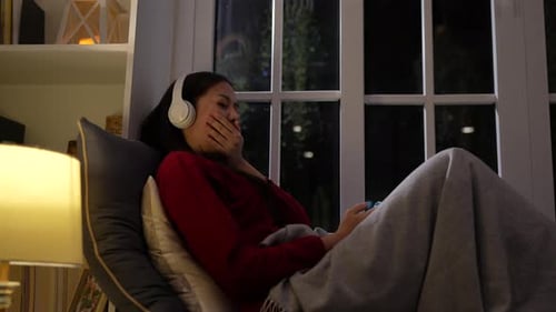 Asian woman working late at night with laptop computer home office