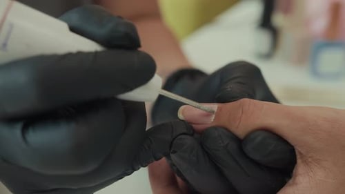 Close up nail technician giving manicure