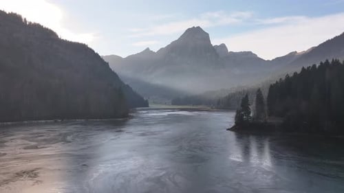 Aerial view of Obersee lake, Näfels, serene alpine reflection & majestic mountains
