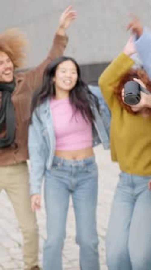 Multiethnic Young Friends Dancing in the Street