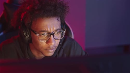 Excited Young Adult Playing Computer Game