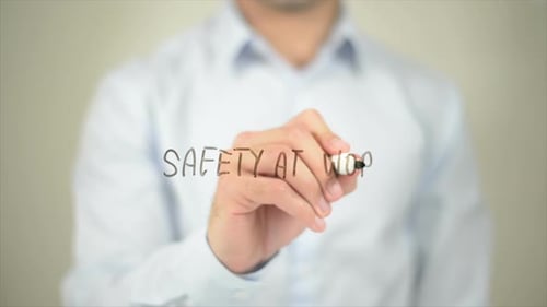 Writing Safety at Work on Clear Surface
