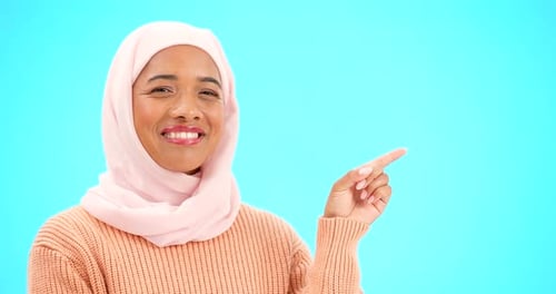Muslim woman, happy and portrait pointing finger at space for mockup, advertising or promotion