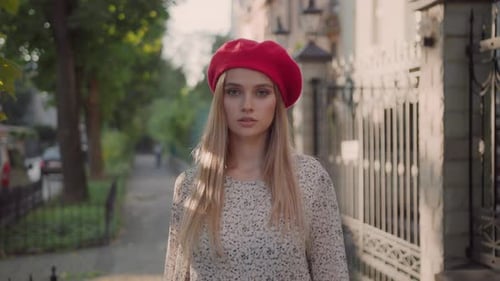 Stylish Woman Walks in Urban Setting
