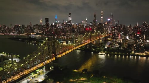 Ed Koch Queensboro Bridge Illuminated At Night In New York City - Aerial Drone Shot