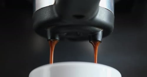 Making Espresso Flowing Fresh Ground Coffee Stream From Professional Machine Close Up