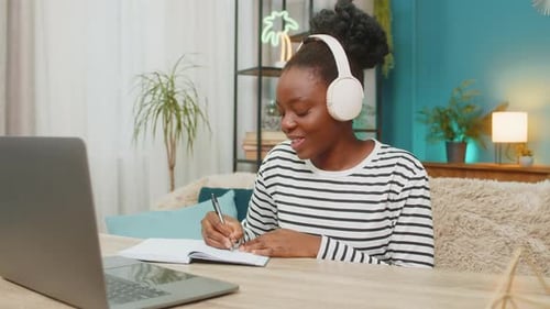 Woman Working at Laptop During Video Conference