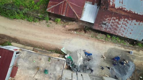 Overhead of construction, concrete pouring in small rural Guatemalan village,
