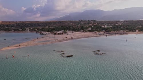 Beautiful sandy beach with clear turquoise water under a serene sky