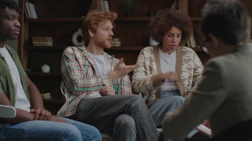 Adults in Group Therapy Session Talking Together