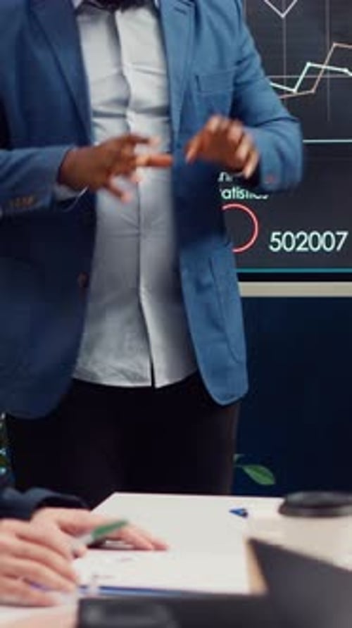 Adults Presenting Business Data in a Corporate Setting