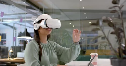Asian woman explores virtual reality in a modern office setting