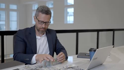 Business Man Counting Dollars in Office Rich Man in Suit with Dollars Business Man Hold Dollars