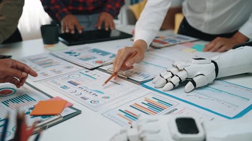 Human and Robot Hands Analyzing Financial Charts Together