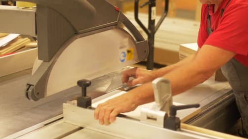 Production, Manufacture and Woodworking Industry Concept - Carpenter Working with Sliding Panel