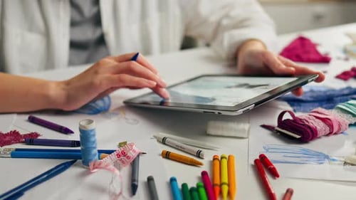 Design Studio For Creative People. Fashion Designer, Draws On Electronic Tablet Fashionable Clothes