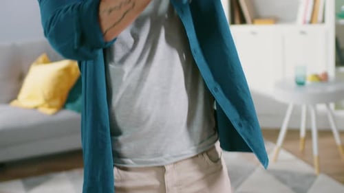 Man Using Virtual Reality Headset in Living Room