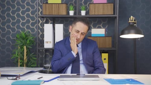 Businessman with aching teeth.