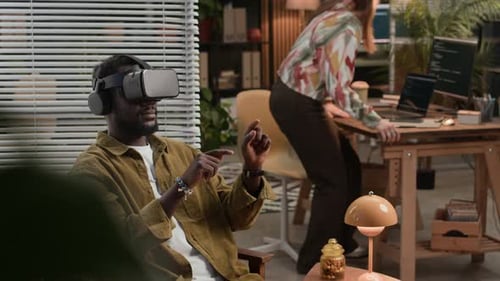 Man Using Virtual Reality Headset in Office