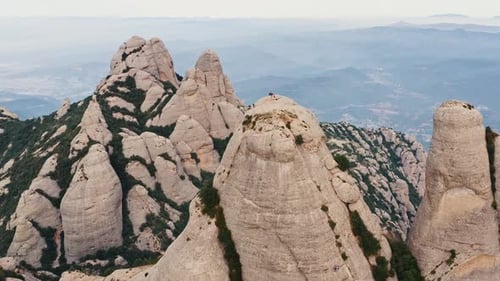 Aerial Drone Shot of Multi Peaked Montserrat Mountain Range in Barcelona Catalonia Spain People