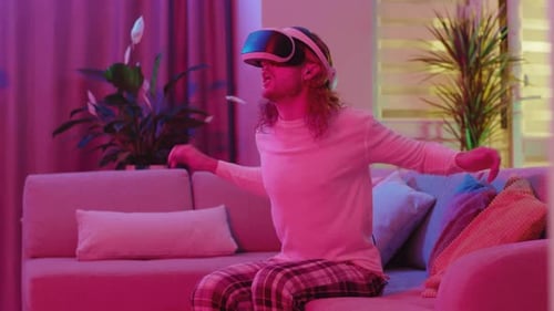 Person Experiencing Virtual Reality on Couch