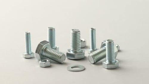 Bolts, Nuts, and Washers on White Surface Zoom