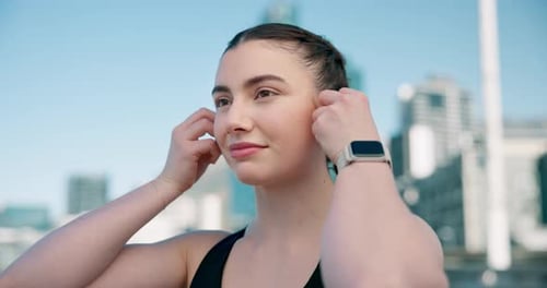 Fitness, earphones or girl runner in city listening to music, podcast or radio playlist in sports