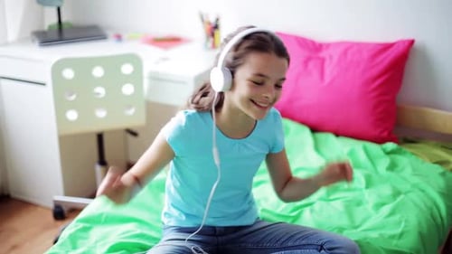 Girl Listening to Music in Her Bedroom