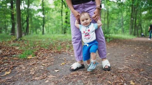 Teaching baby boy to walk.