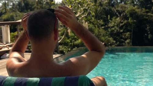 Young Man Relaxing on Sunbed by Swimming Pool, Super 240