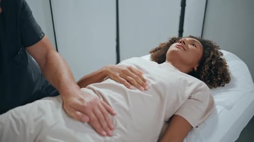 Patient Visiting Physiotherapy Doctor in Clinic Closeup Therapist Hands Examine