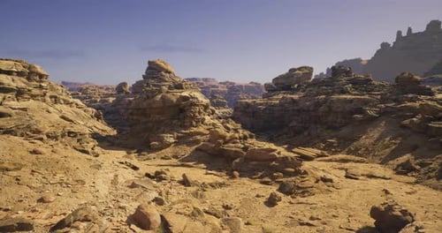 Majestic Rock Formations in a Vast Desert Landscape During Daylight Hours