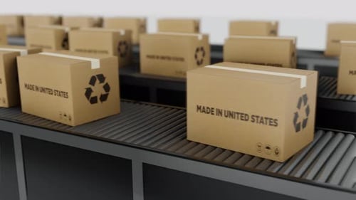 Stream Of Boxes Labeled 'Made In The United States' Moving On a Conveyor Line