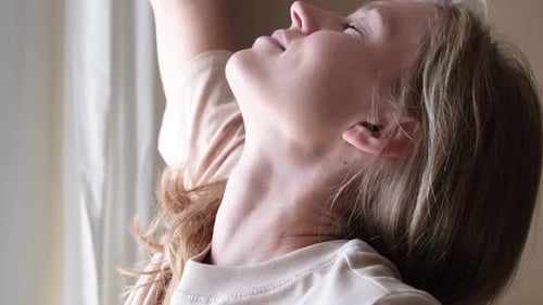 Woman Enjoying a Morning Coffee by the Window