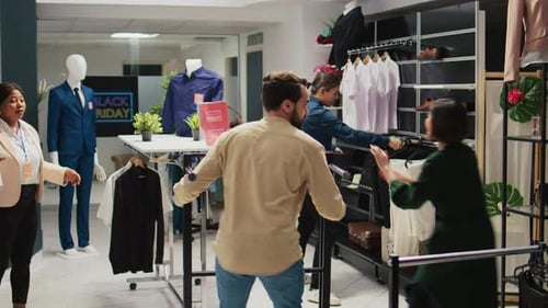 Frantic Shoppers Rushing Into Clothing Store on Black Friday