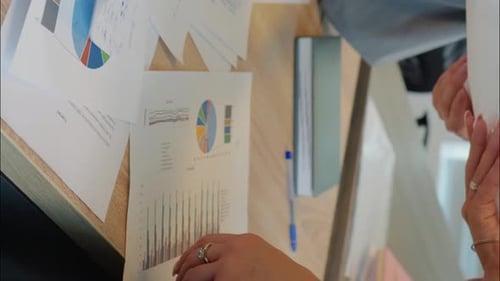 Data Charts Laid Out on Desk for Analysis