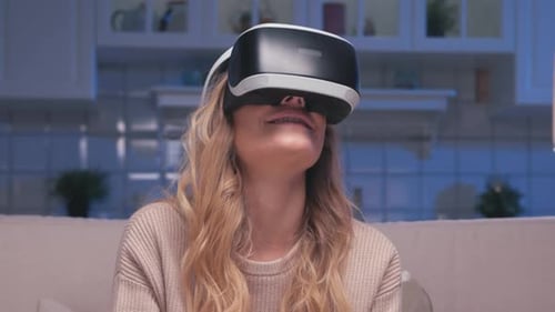 Woman Using Virtual Reality Headset in Home