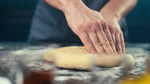 Closeup of a Woman's Hands Making a Pie Form Out of Dough